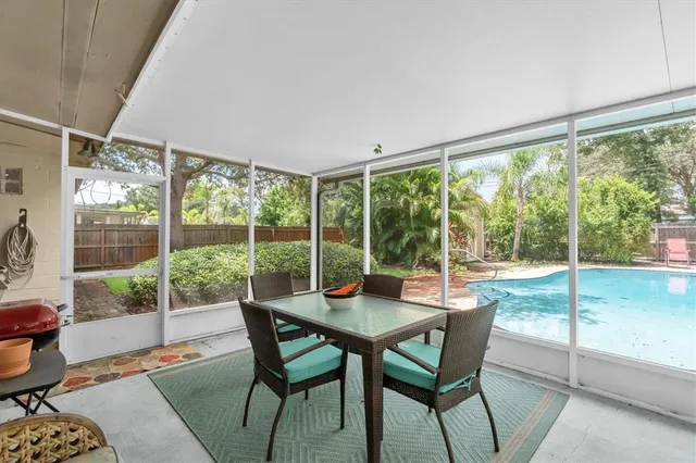 a view of a room with a furniture and garden view