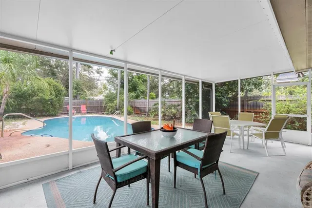 a view of a dining room with furniture window and outside view