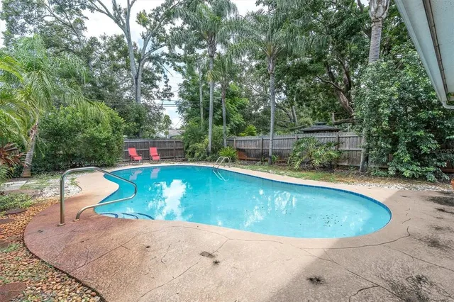 a view of a swimming pool with a patio