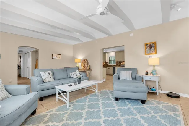 a living room with furniture and a table