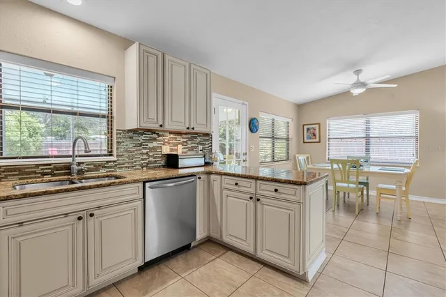 a kitchen with a sink and cabinets