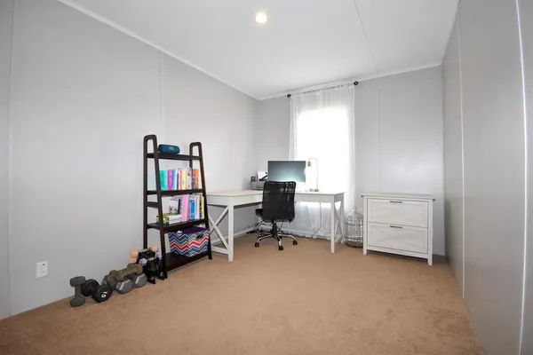 a view of a workspace with furniture