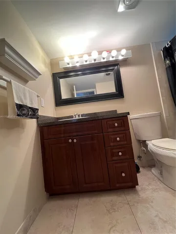 a bathroom with a toilet and a sink