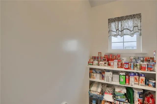 a room with books and a book shelf