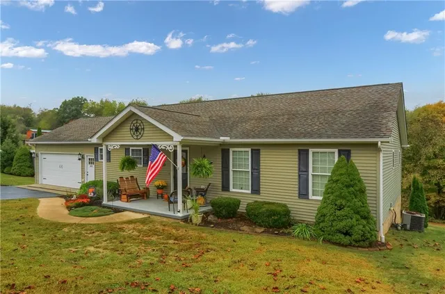 a view of a house with basketball court