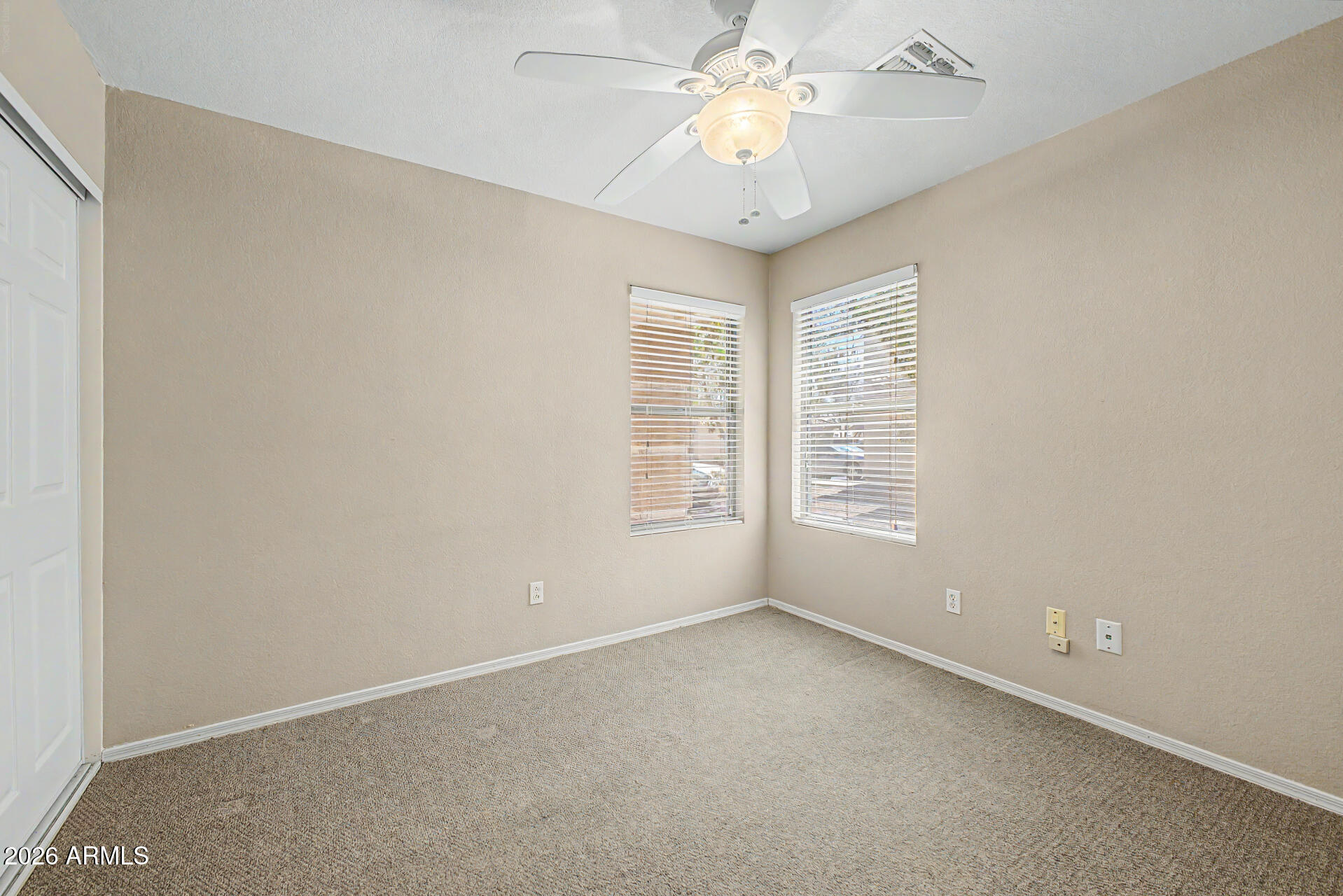 3489 South Bowman Road Apache Junction, AZ 85119 - Photo 20 of 24 an empty room with a window