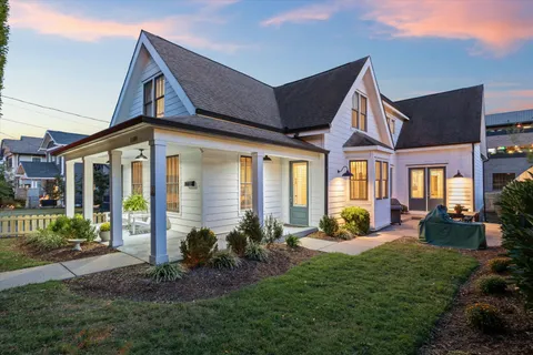 a front view of a house with wooden fence