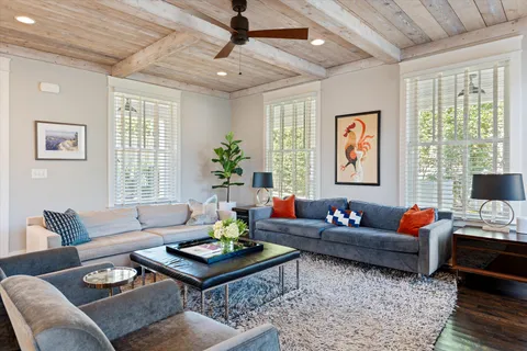 a bedroom with a bed mirror and a table