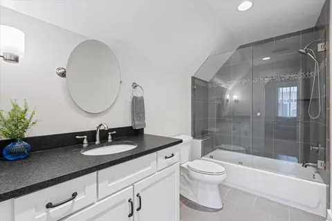 a view of bath room with a bathtub and next to a window