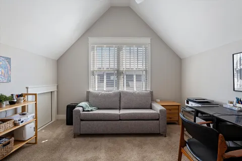 a bathroom with a tub sink shower and mirror