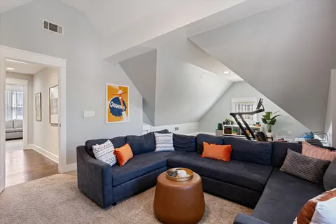 a spacious bathroom with a granite countertop sink mirror and a bathtub