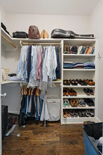 a bedroom with a bed and a chair