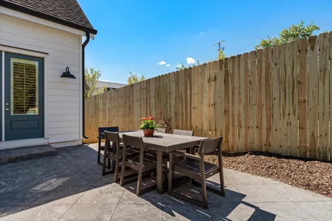 an aerial view of a house with a swimming pool yard and outdoor seating