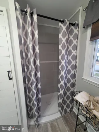 a bathroom with a shower and a toilet