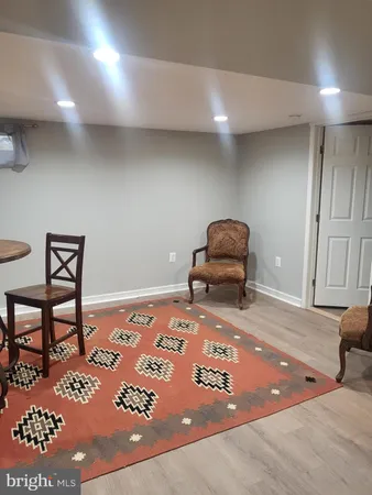 a bedroom with a bed and a chair in it