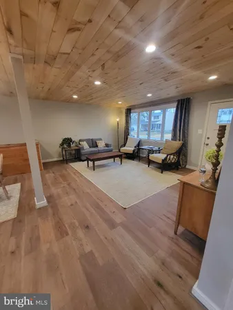 a lobby with furniture and a wooden floor
