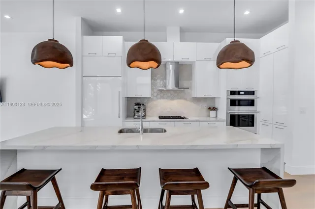 a kitchen with a sink cabinets and window