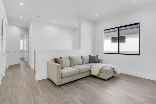 a living room with furniture and a window
