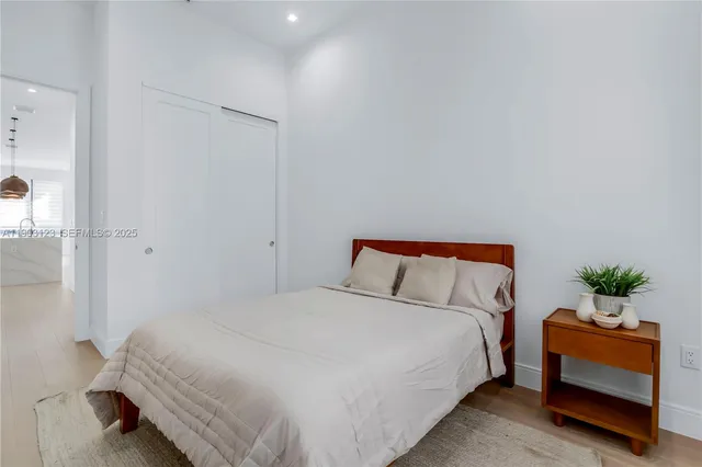 a bedroom with a bed and a couch