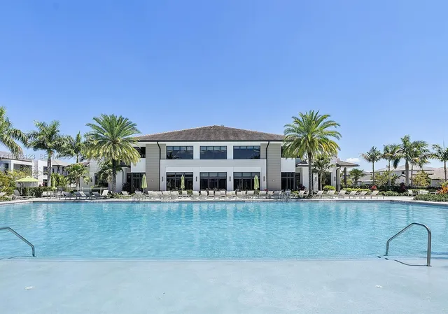 a view of a house with outdoor space and sitting area