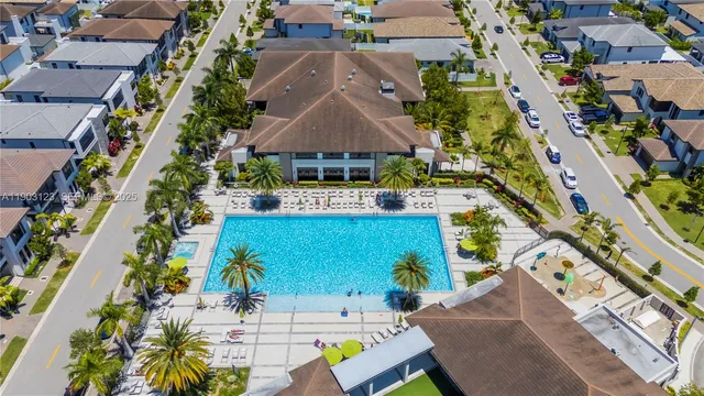 an aerial view of multiple houses with yard