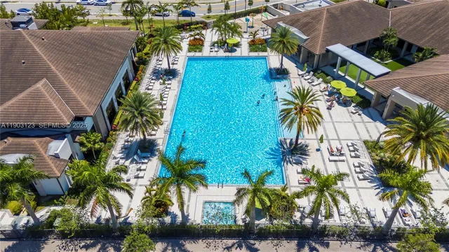 an aerial view of multiple houses with yard