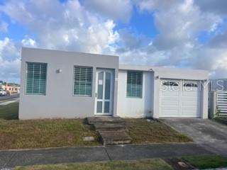 2 Urb Vista Catano, PR 00962 - Photo 1 of 1 a front view of house with yard