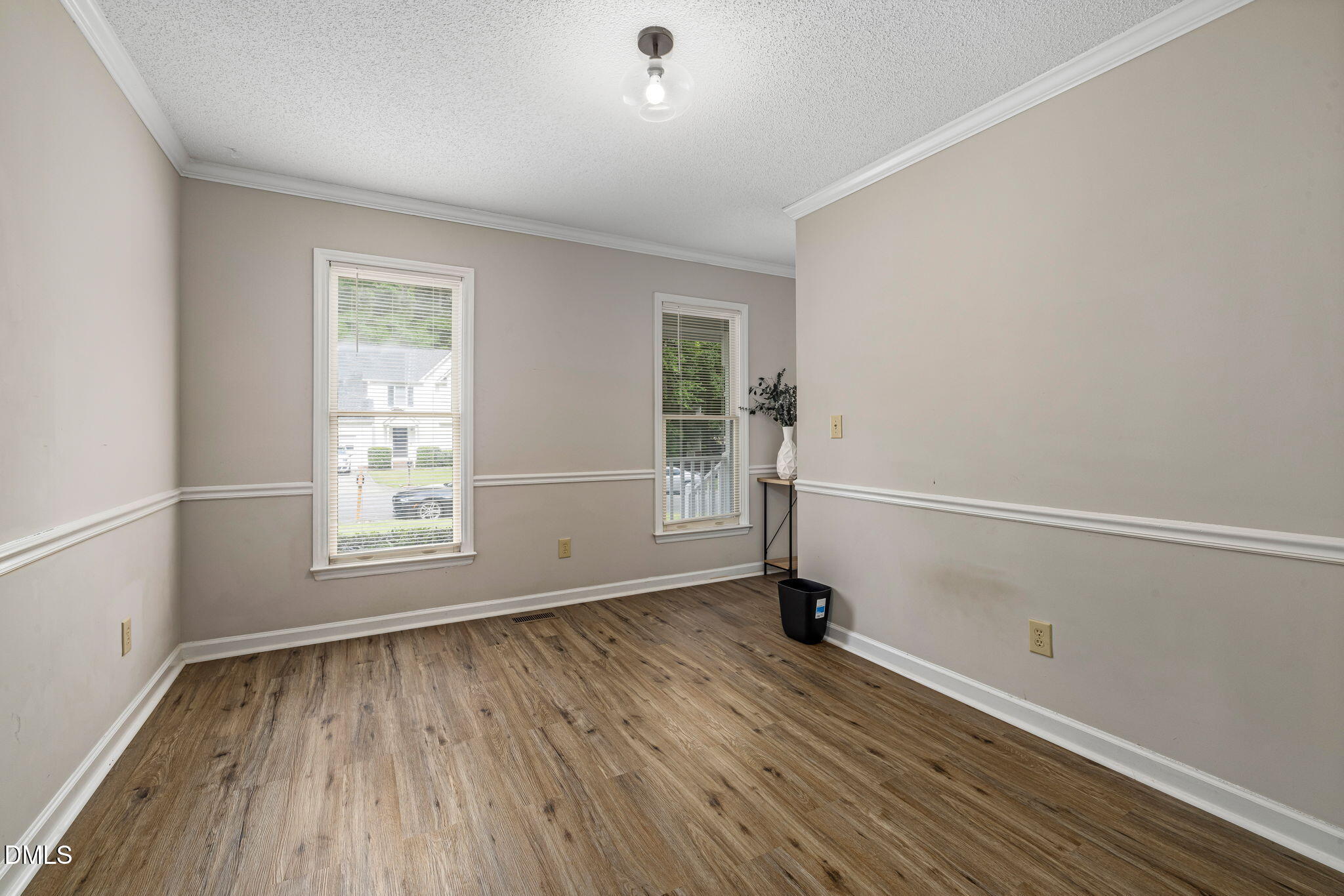 403 Chadbourne Drive Durham, NC 27703 - Photo 14 of 30 wooden floor in an empty room with a window