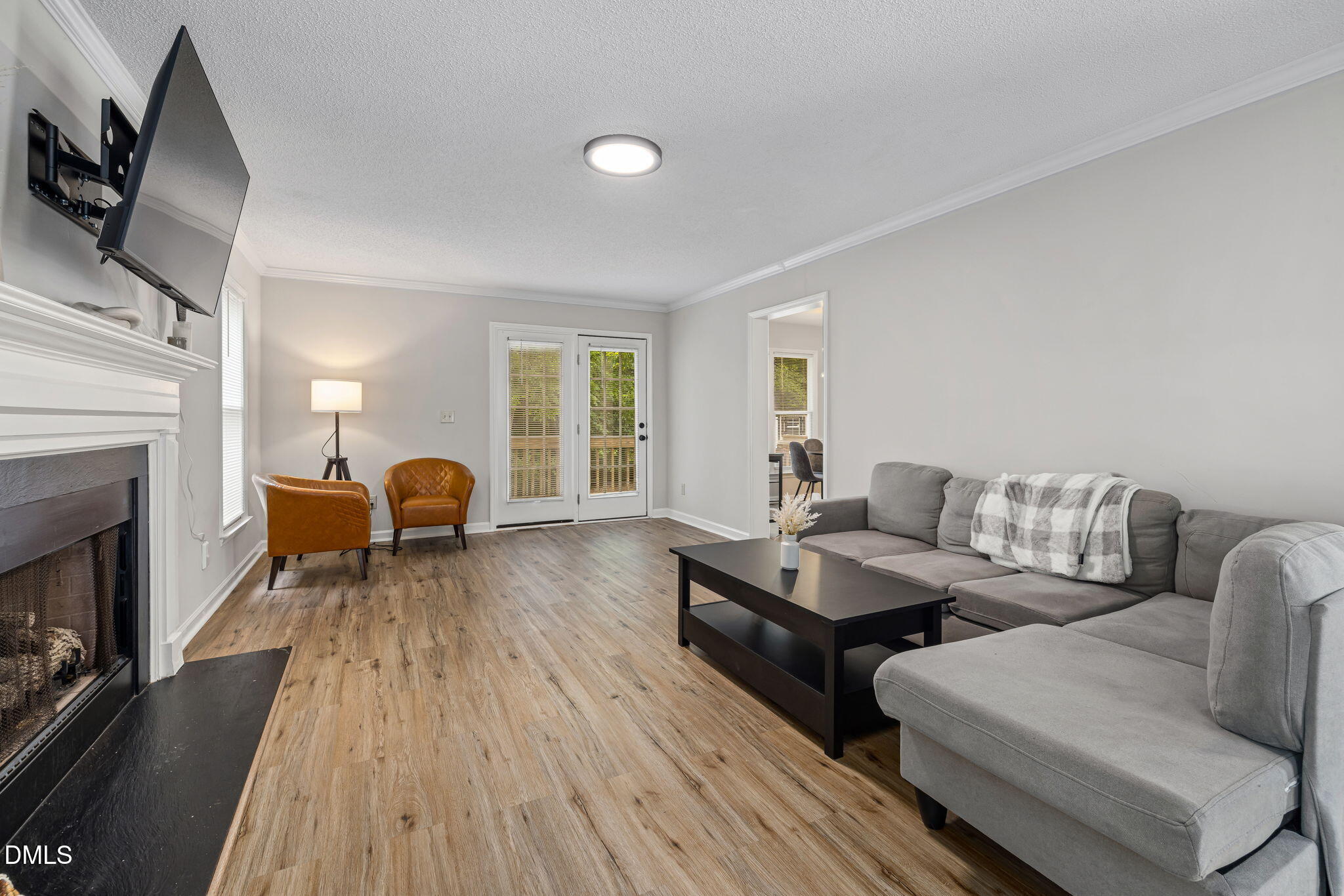403 Chadbourne Drive Durham, NC 27703 - Photo 7 of 30 a living room with furniture and a fireplace