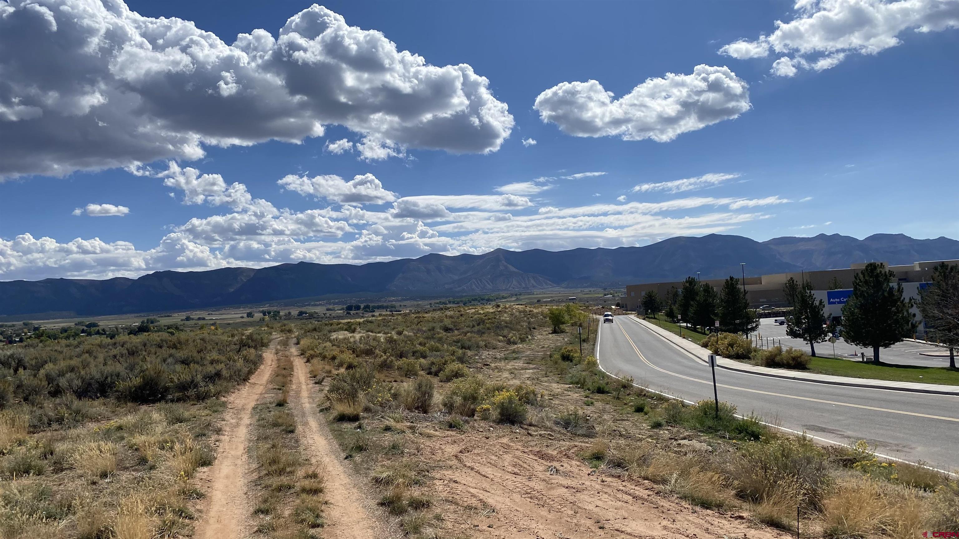 Tbd Cactus Street Cortez, CO 81321 - Photo 4 of 5 a view of a house with a yard