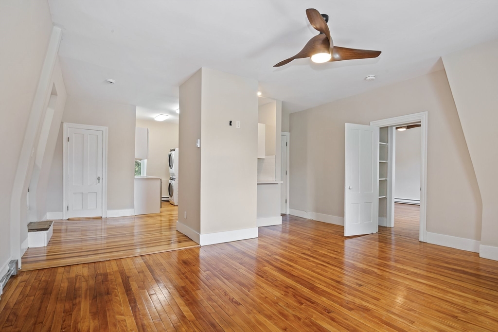 a view of a livingroom with wooden floor