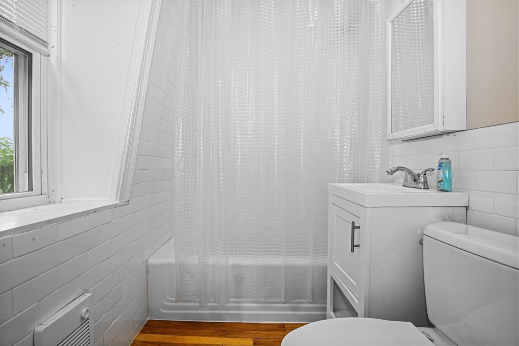 35 Oak Avenue, Unit 3 Worcester, MA 01605 - Photo 12 of 24 a bathroom with a sink and a bathtub