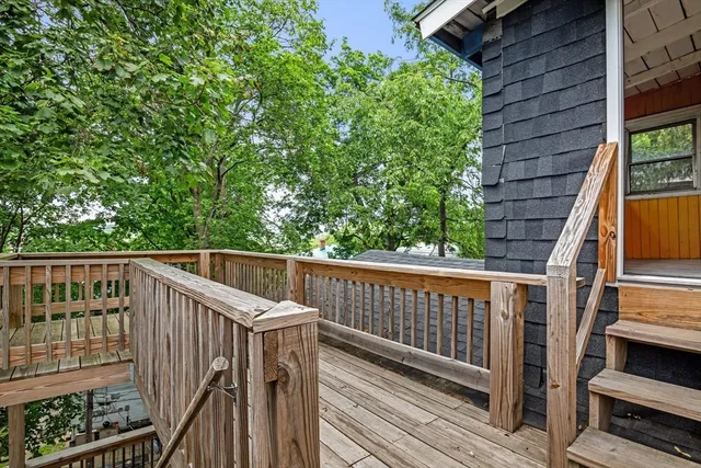 a view of balcony with wooden floor