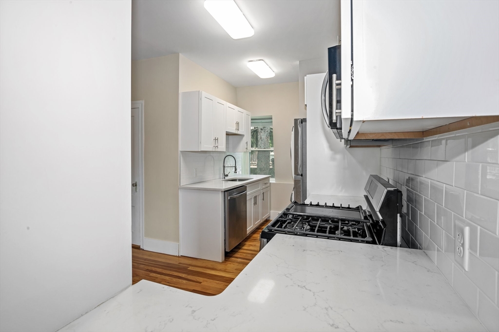 35 Oak Avenue, Unit 3 Worcester, MA 01605 - Photo 3 of 24 a kitchen with a sink and a stove top oven