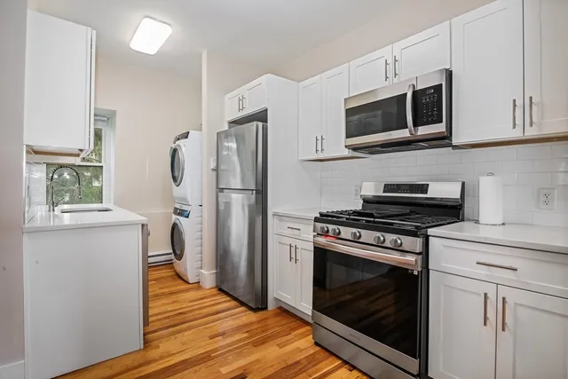 a kitchen with a stove microwave and refrigerator