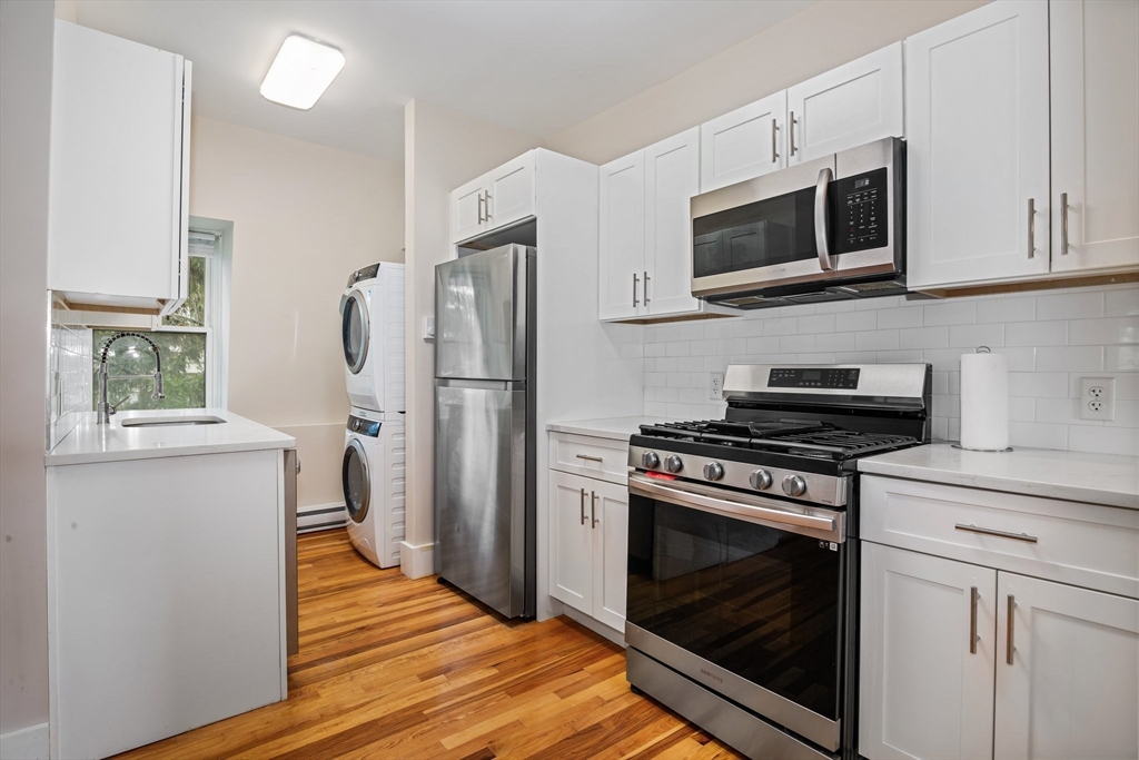 35 Oak Avenue, Unit 3 Worcester, MA 01605 - Photo 4 of 24 a kitchen with a stove microwave and refrigerator