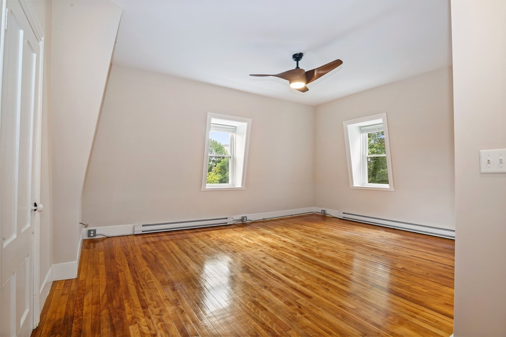 35 Oak Avenue, Unit 3 Worcester, MA 01605 - Photo 7 of 24 wooden floor in an empty room with a window