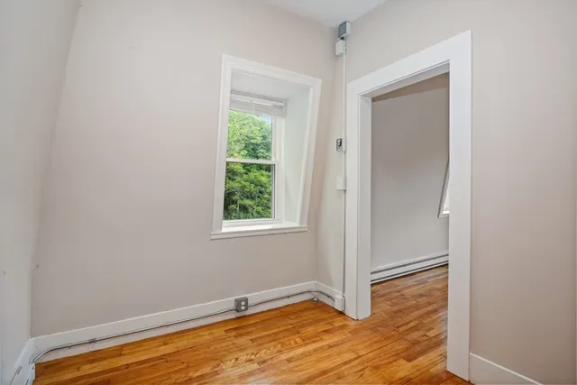 a view of a room with wooden floor and closet