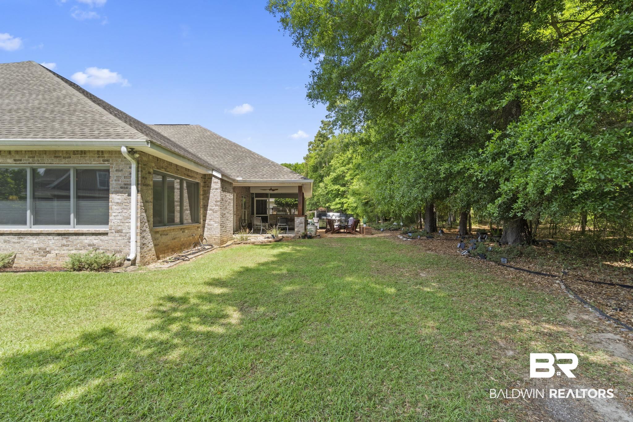 8664 Foxtail Loop Pensacola, FL 32526 - Photo 55 of 64 View of green lawn