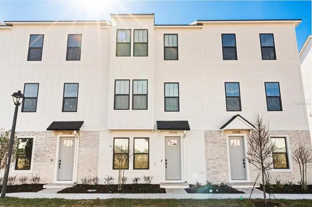 a view of a building with a yard