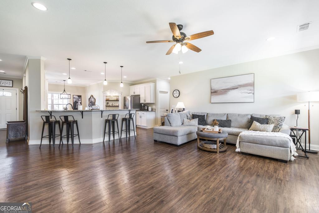 609 Live Oak Way Dublin, GA 31021 - Photo 11 of 37 a living room with furniture and a large window