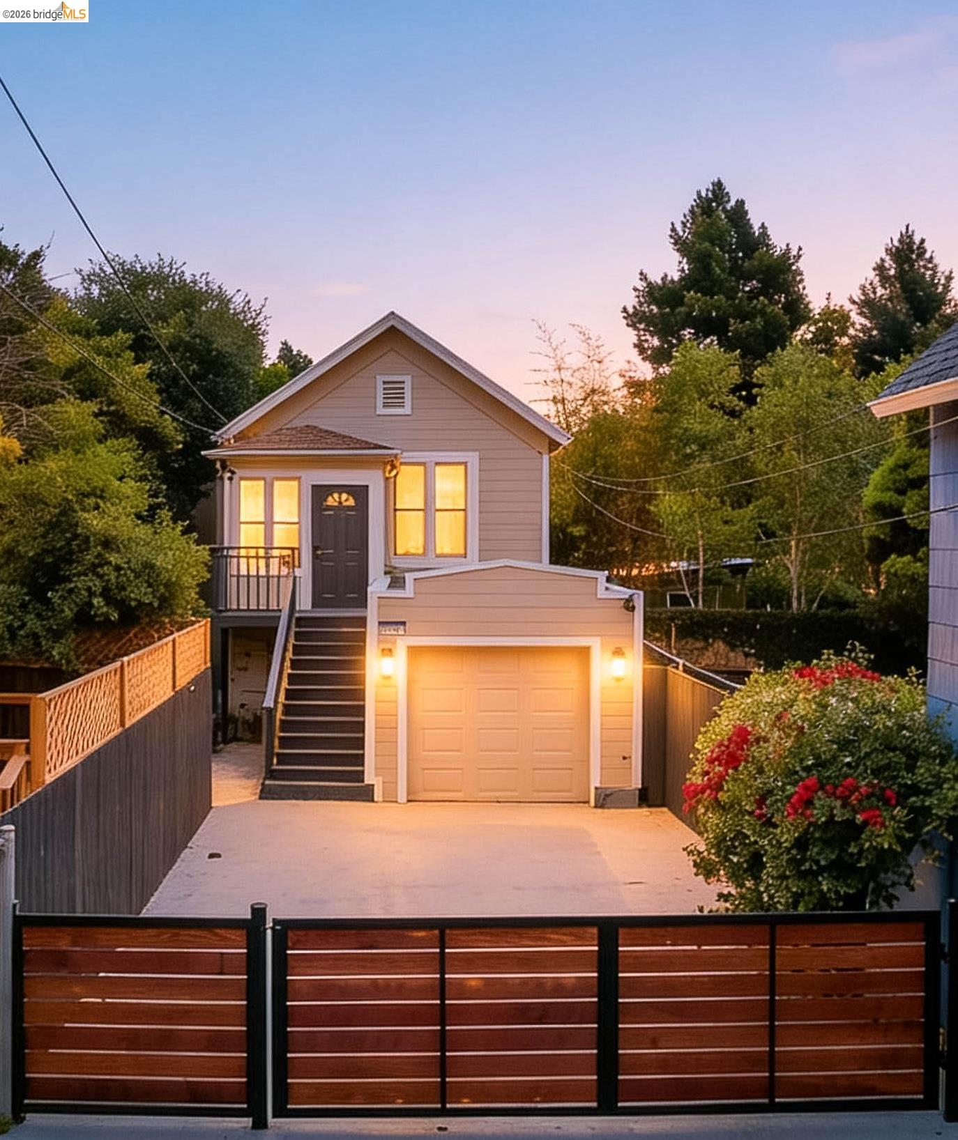 1812 Woolsey Street Berkeley, CA 94703 - Photo 2 of 48 Contemporary home featuring a neutral-toned exterior, a dedicated garage, and an elevated entry with a dark gray door
