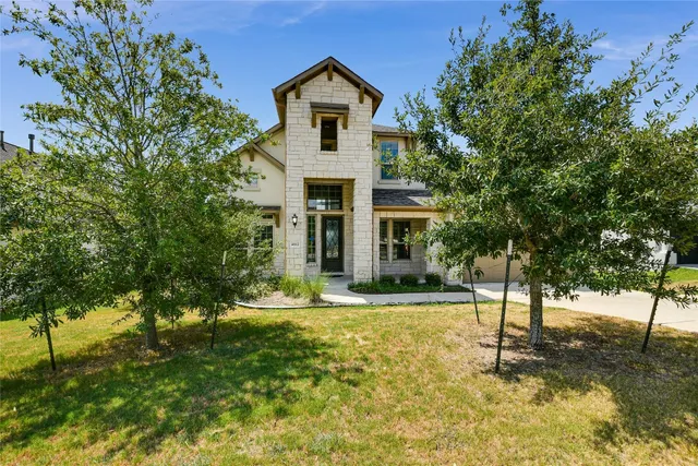 a front view of a house with a yard