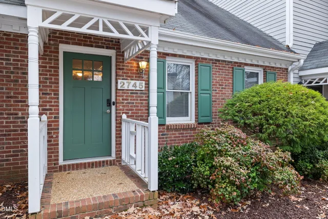 front view of a house with a small yard
