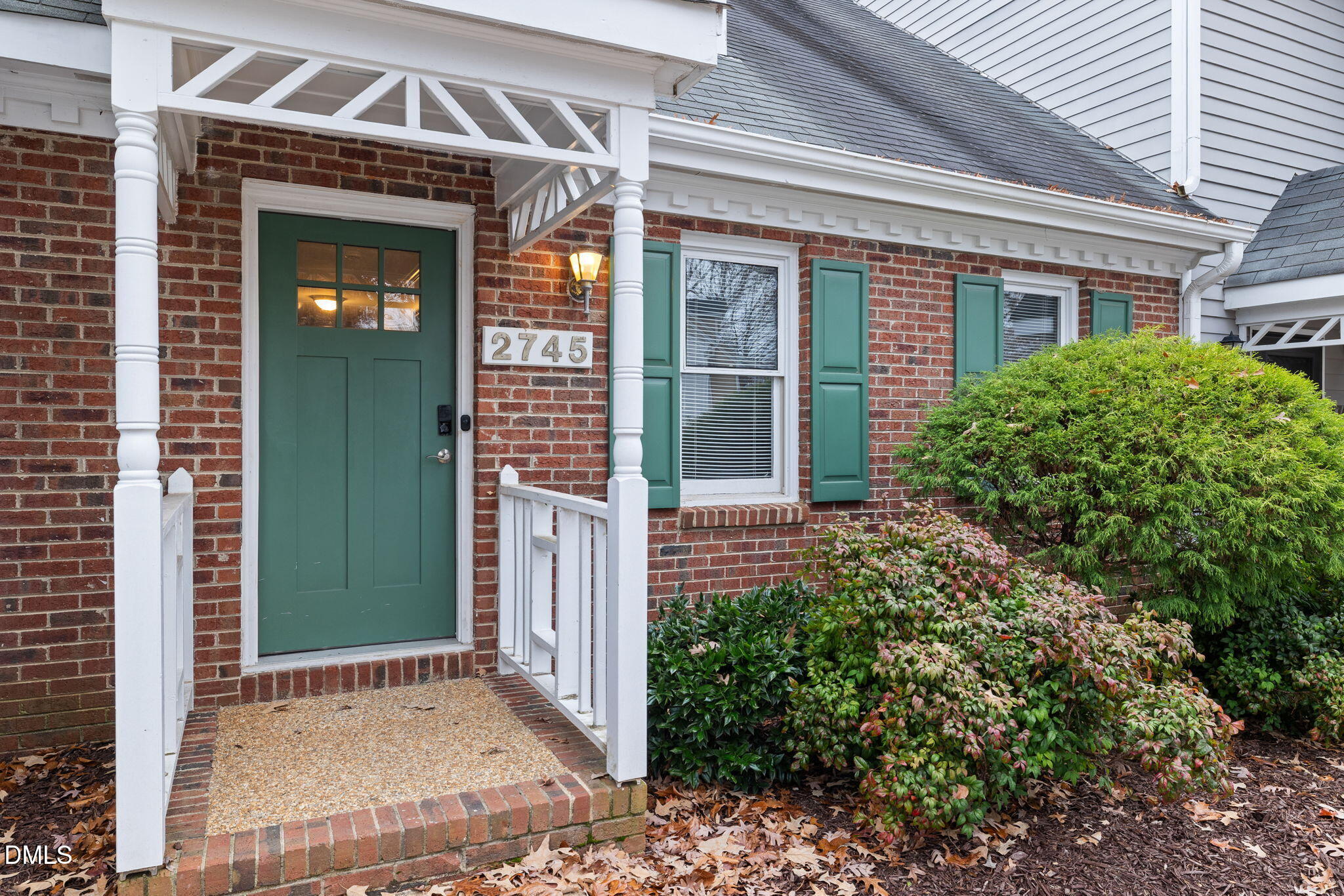 front view of a house with a small yard