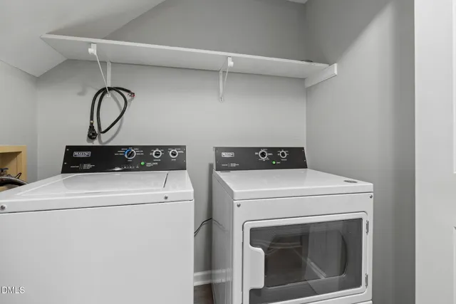 a kitchen with stainless steel appliances a refrigerator and a stove top oven
