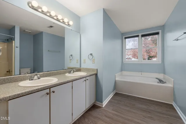 an empty room with a empty space and windows