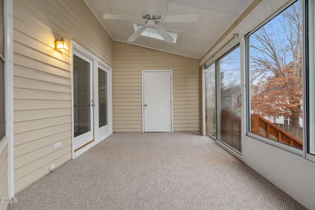 a view of a hallway with windows