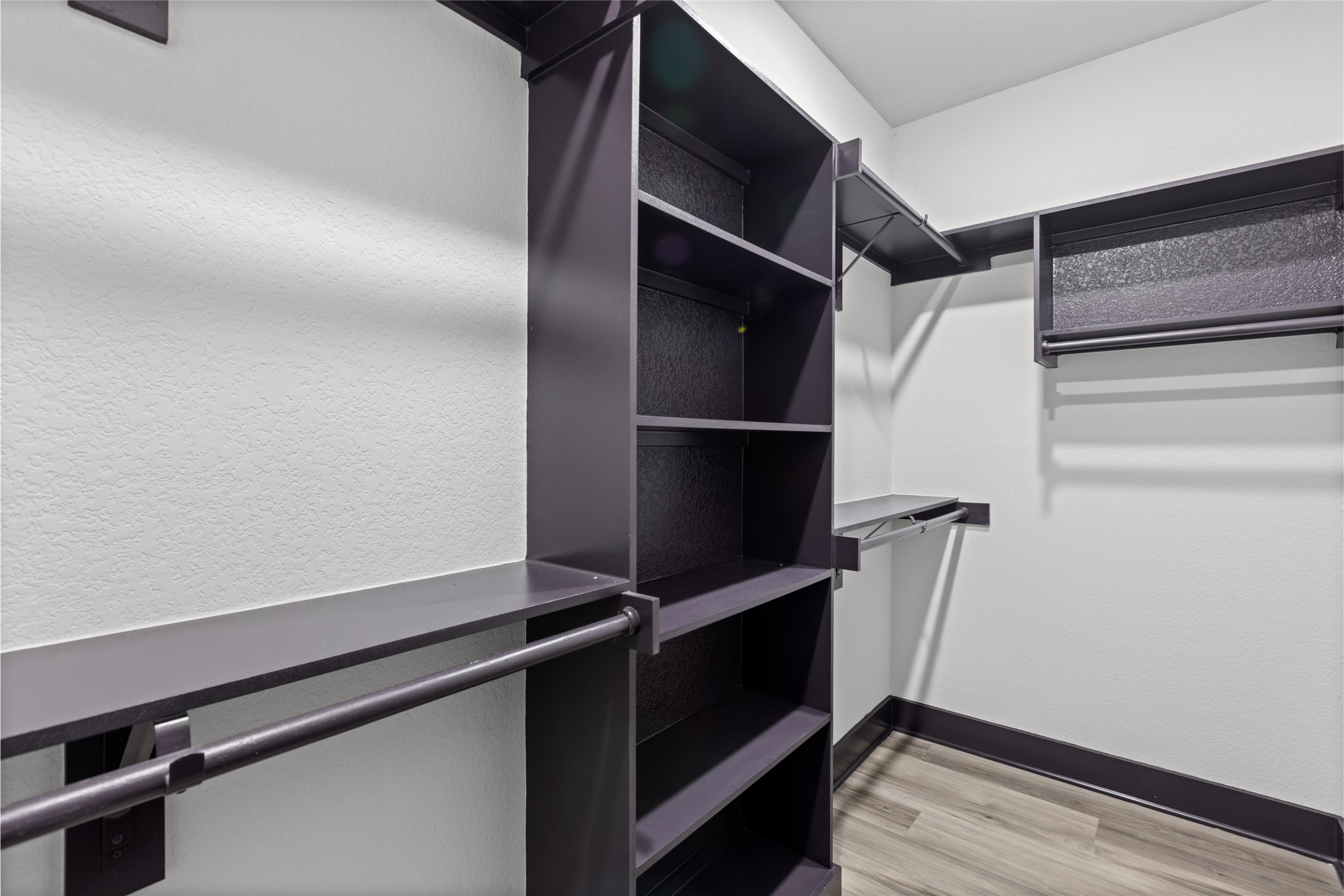 4435 Maggie Street, Unit B Houston, TX 77051 - Photo 20 of 37 a view of walk in closet with empty racks