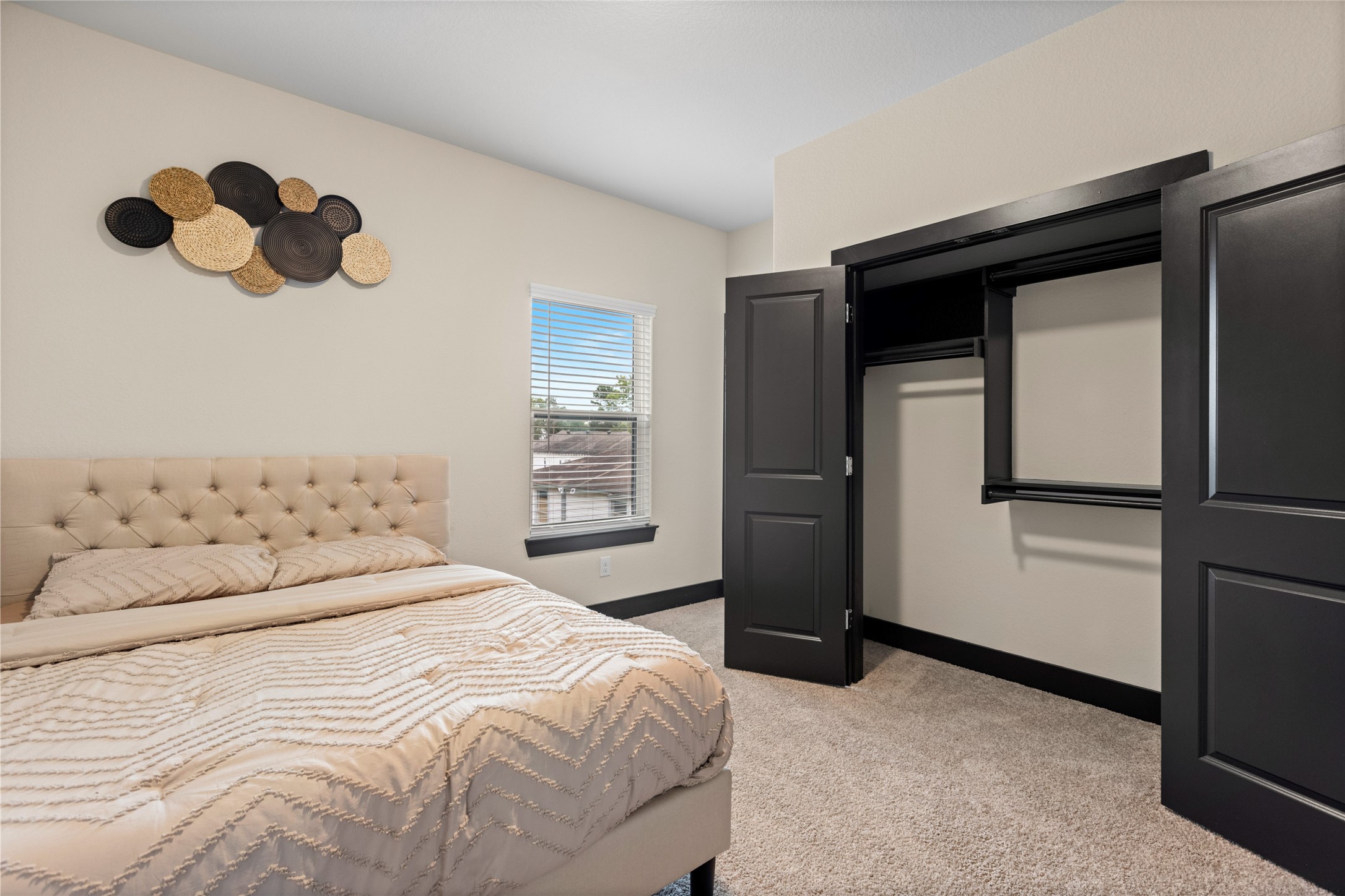 4435 Maggie Street, Unit B Houston, TX 77051 - Photo 24 of 37 a bedroom with a bed and a window